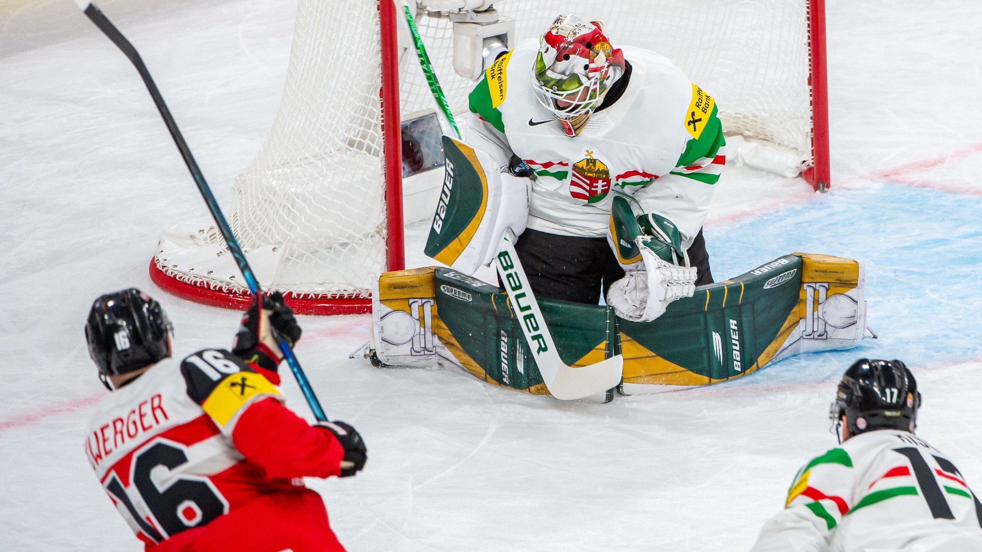 ZURICH, SWITZERLAND - MAY 17: Dominic Zwerger #16 of Austria tries to score against Goalie Bence Balizs #1 of Hungary during the 2026 IIHF Ice Hockey World Championship Switzerland game between Austria and Hungary at Swiss Life Arena on May 17, 2026 in Zurich, Switzerland. (Photo by RvS.Media/Robert Hradil/Getty Images)